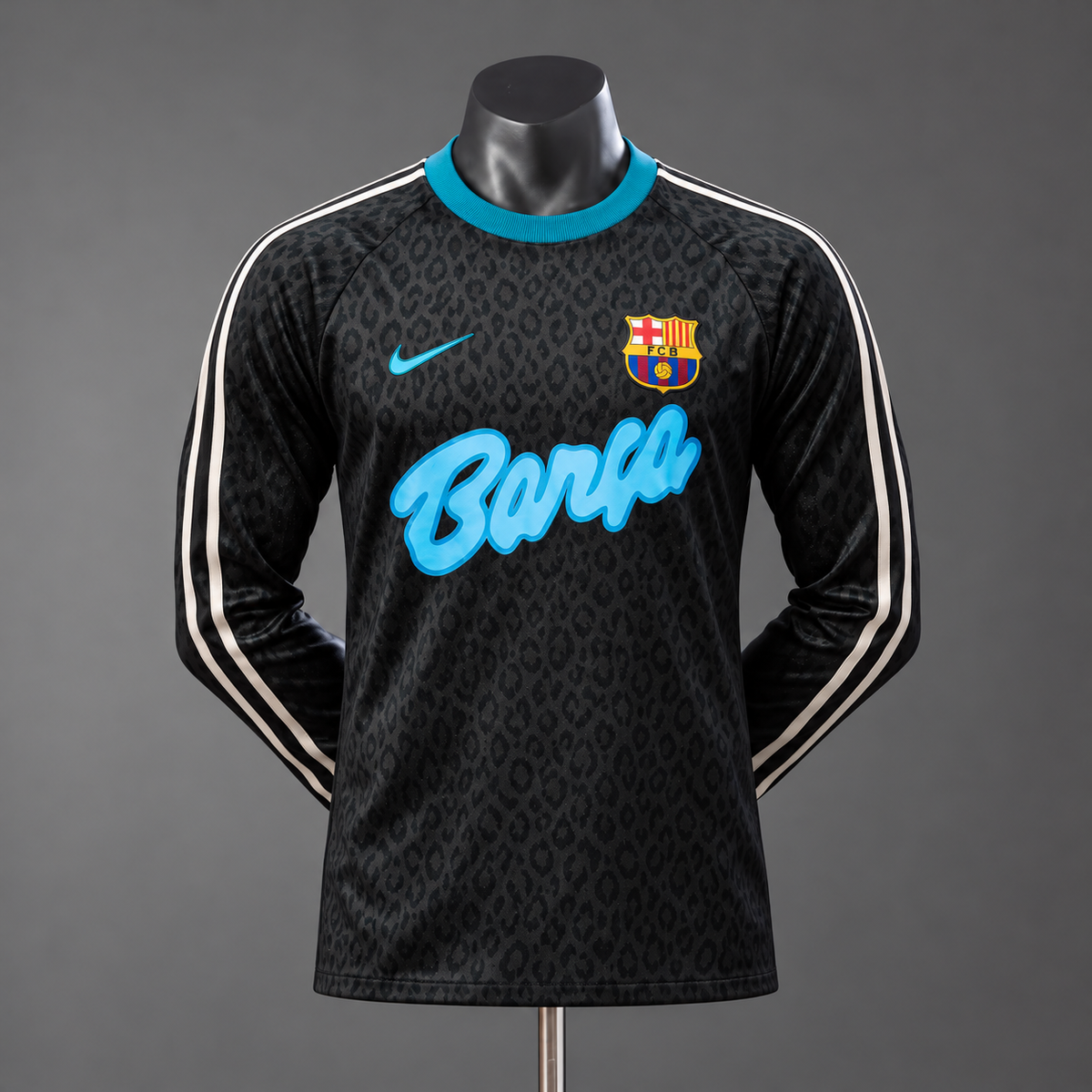 Black Barcelona leopard-print long-sleeve jersey with turquoise Barça script and white sleeve stripes on mannequin